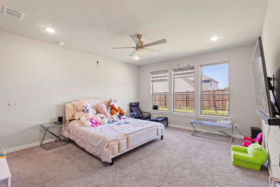 Bedroom with carpet flooring, recessed lighting, and ceiling fan