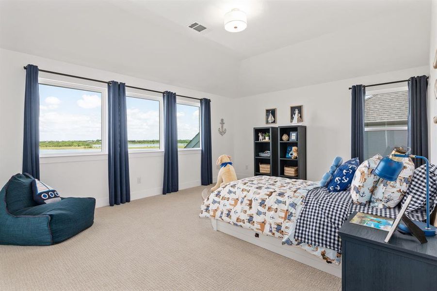 Bedroom featuring carpet and baseboards Bedroom featuring carpet and baseboards