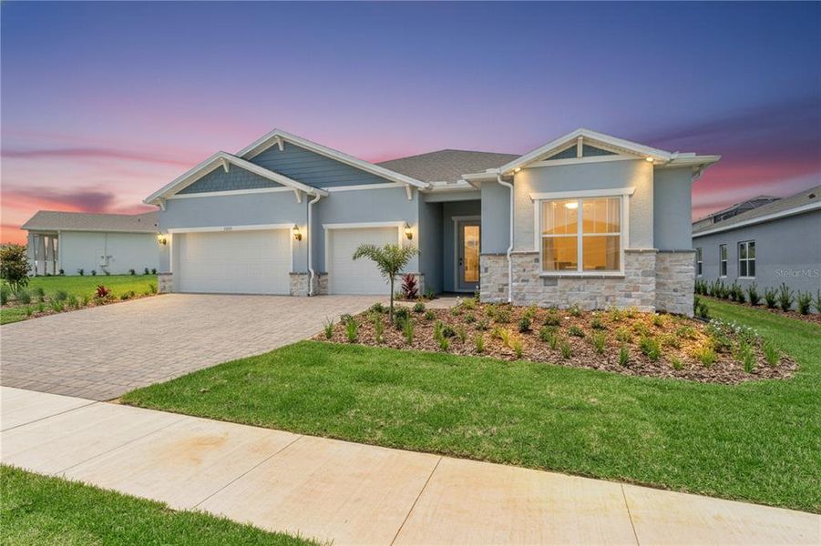 Front exterior of a new home in , Minneola, FL, highlighting curb appeal (Image 1). Front exterior of a new home in , Minneola, FL, highlighting curb appeal (Image 1).