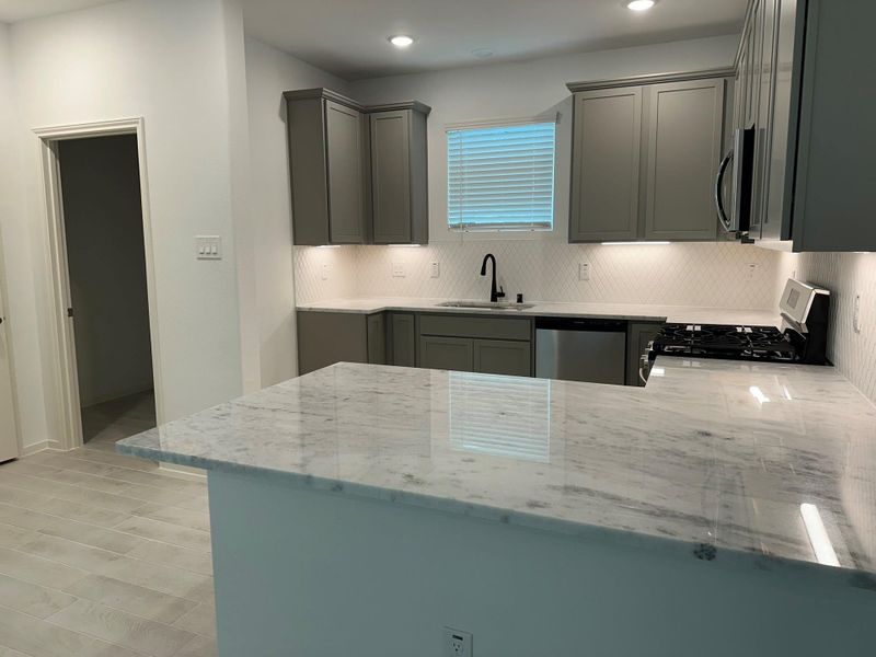 Furnished interior view inside a new home in Creekhaven, Iowa Colony (Image 6).