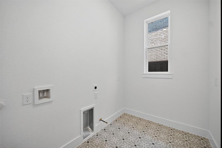 Bedroom featuring light carpet, a tray ceiling, and ceiling fan