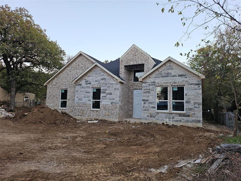 View of front of home featuring stone siding View of front of home featuring stone siding