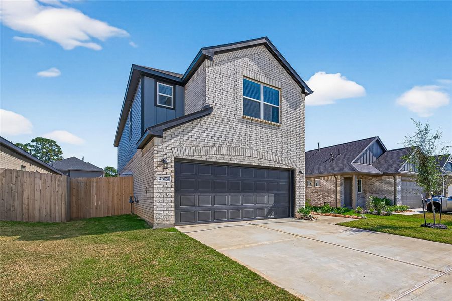 Front exterior of a new home in Mill Creek Trails, Magnolia, TX, highlighting curb appeal (Image 24). Front exterior of a new home in Mill Creek Trails, Magnolia, TX, highlighting curb appeal (Image 24).