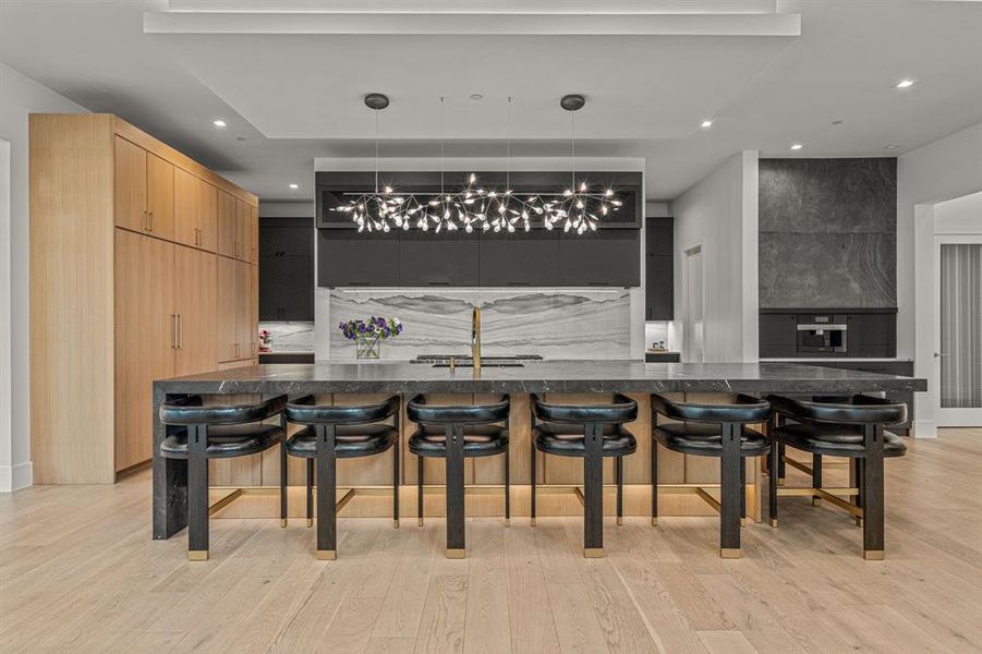 Gourmet kitchen with oversized Quartzite Island