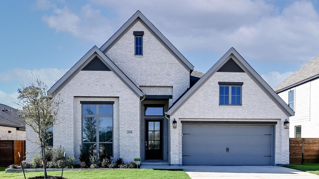 Front exterior of a new home in Juniper Springs, Lockhart, TX, highlighting curb appeal (Image 26).