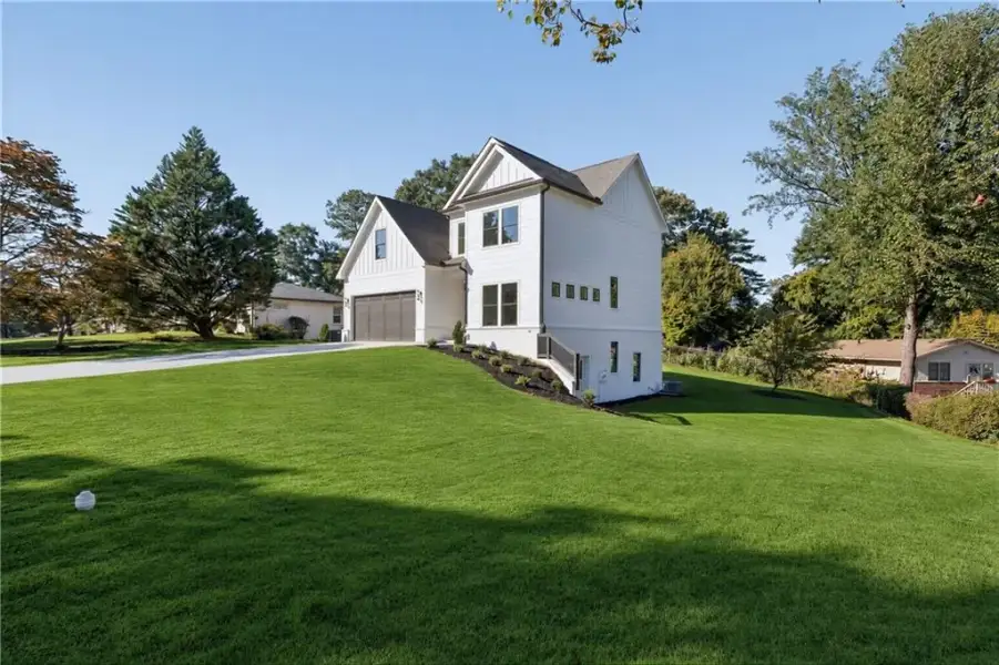 Front exterior of a new home in , Atlanta, GA, highlighting curb appeal (Image 26).