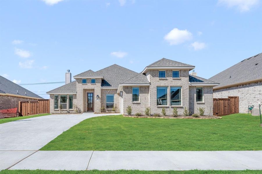 Front exterior of a new home in Somerset, Venus, TX, highlighting curb appeal (Image 25).