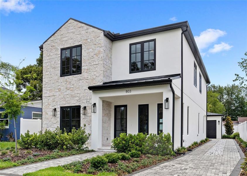 Front exterior of a new home in , Orlando, FL, highlighting curb appeal (Image 29). Front exterior of a new home in , Orlando, FL, highlighting curb appeal (Image 29).