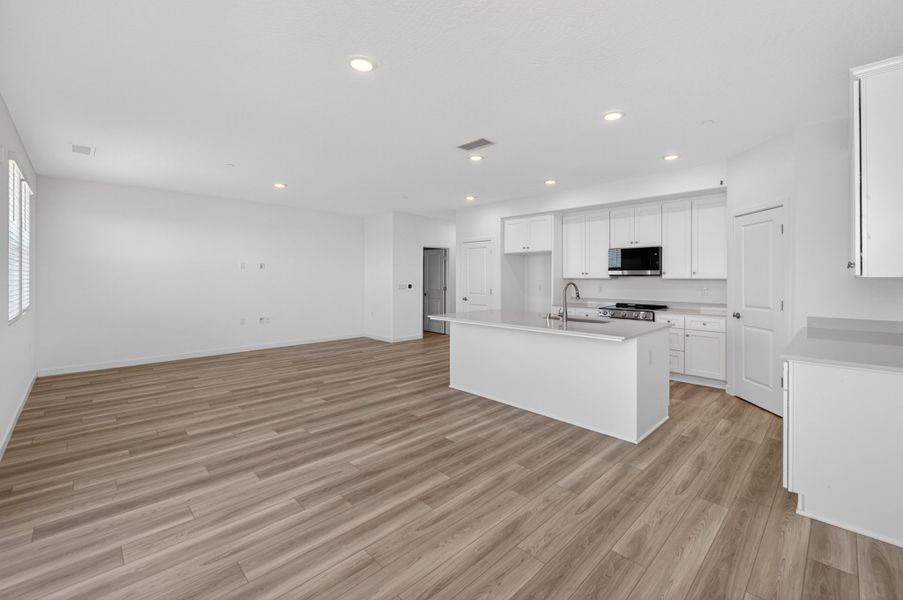 A kitchen with white cabinets. A kitchen with white cabinets.
