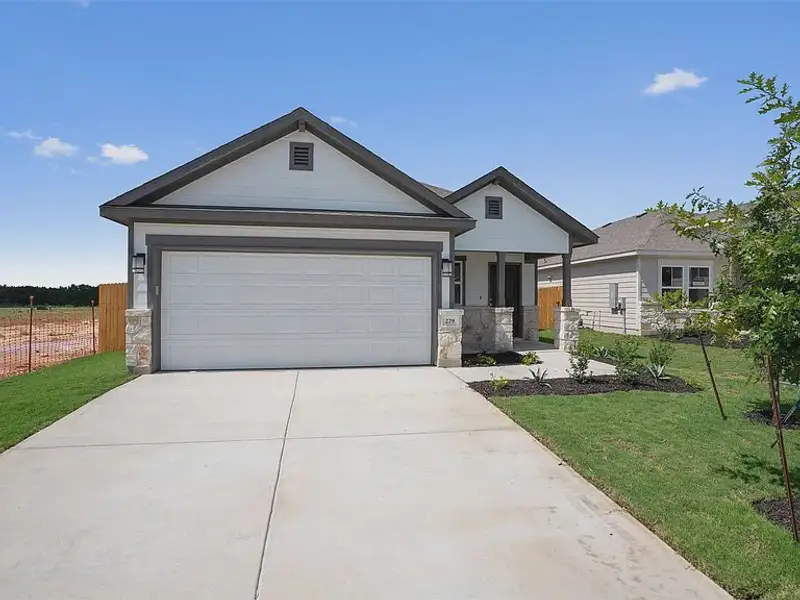 Front exterior of a new home in Yowell Ranch, Killeen, TX, highlighting curb appeal (Image 1). Front exterior of a new home in Yowell Ranch, Killeen, TX, highlighting curb appeal (Image 1).