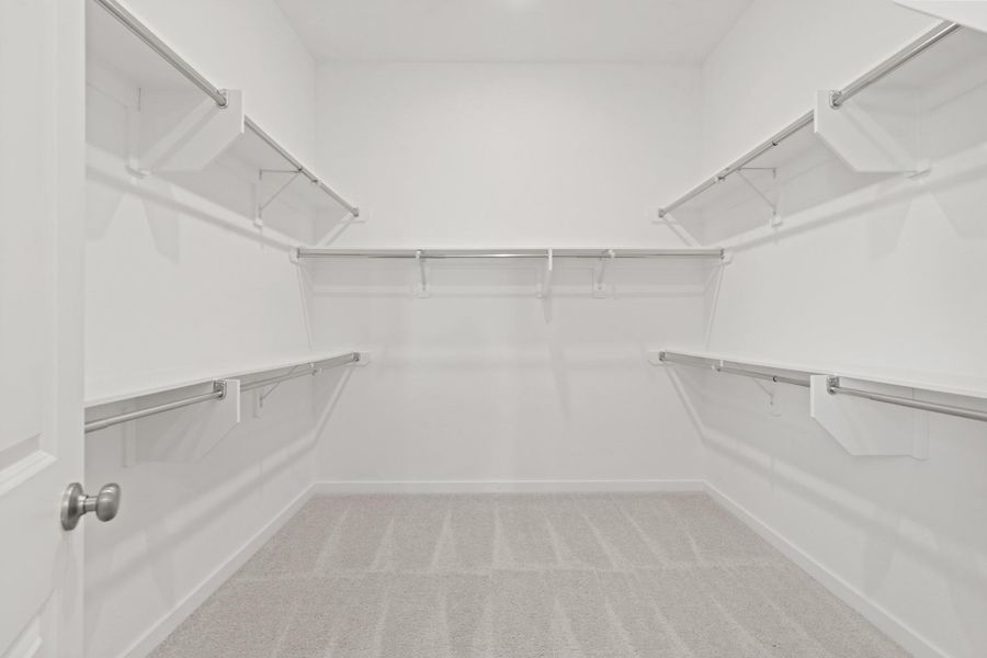 Storage meets style in this oversized primary closet! With ample space, this walk-in sanctuary keeps everything beautifully organized while adding a touch of luxury to your daily routine.