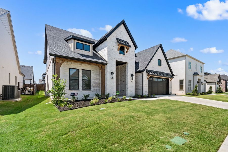 Front exterior of a new home in Parks of Aledo, Aledo, TX, highlighting curb appeal (Image 25).