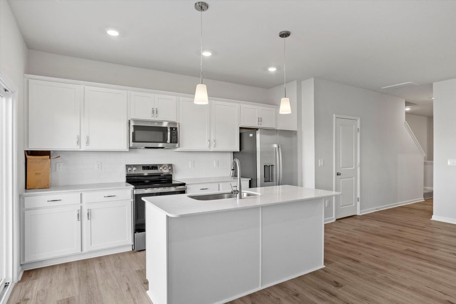 Furnished interior view inside a new home in West Main Townhomes, Sanford (Image 4).