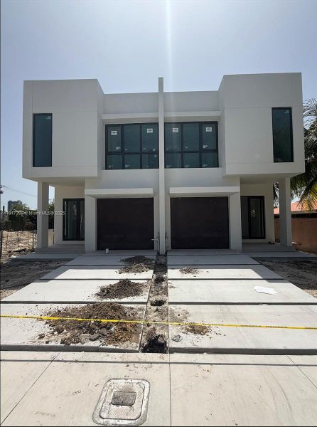Front exterior of a new home in , Miami, FL, highlighting curb appeal (Image 1).