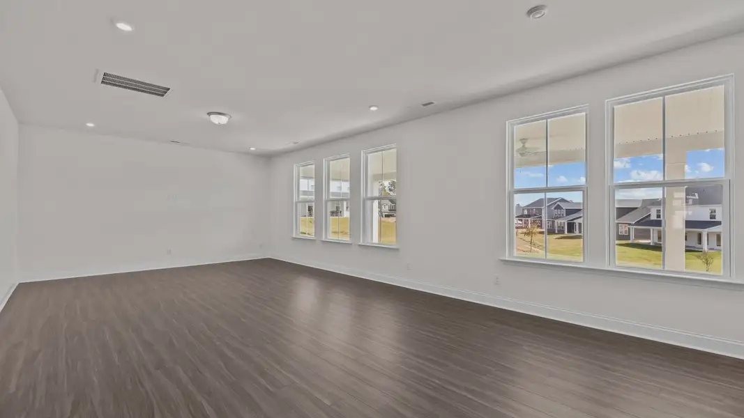 Burton Design open concept family room with large windows for abundant natural light. At Lakeside Glen by DRB Homes, York, SC Burton Design open concept family room with large windows for abundant natural light. At Lakeside Glen by DRB Homes, York, SC