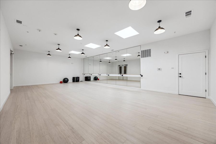 Bright, spacious studio with expansive mirrors and durable flooring offers an ideal workout space. Bright, spacious studio with expansive mirrors and durable flooring offers an ideal workout space.