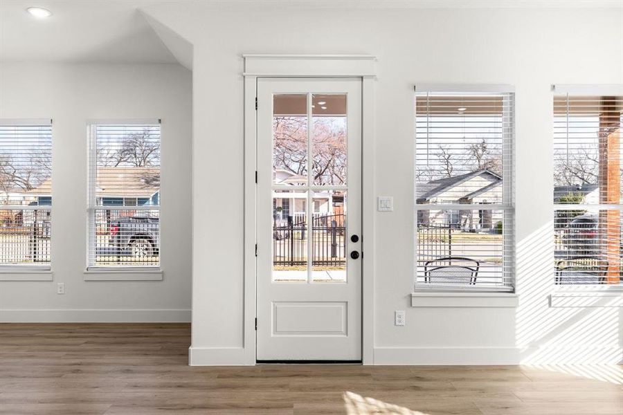 Doorway to outside with hardwood / wood-style flooring