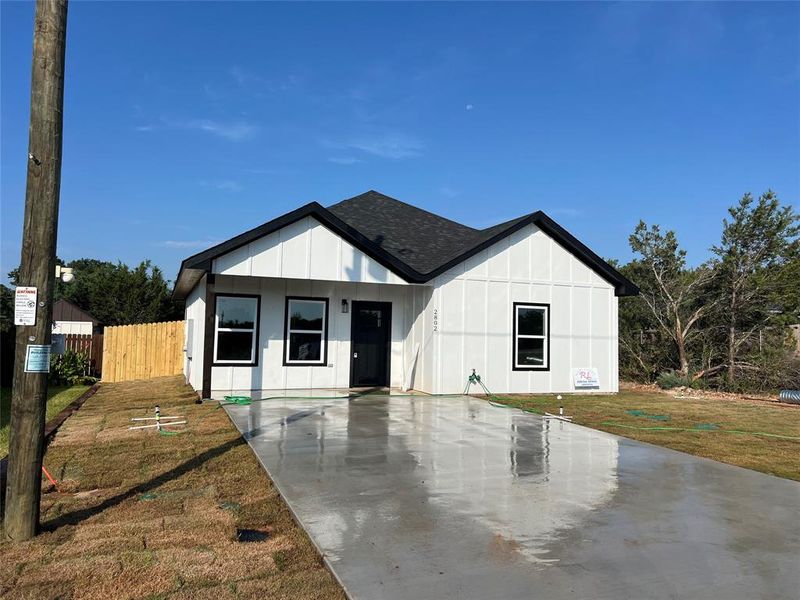 View of front of home featuring a front lawn