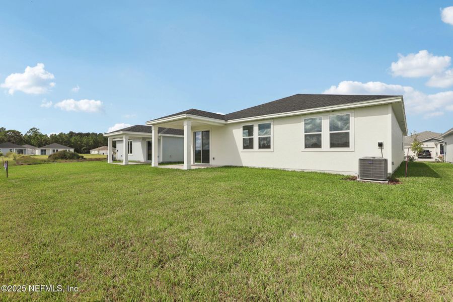 Exterior details and patio area of a home in Lakes at Bella Lago - Signature Series, Green Cove Springs (Image 22).