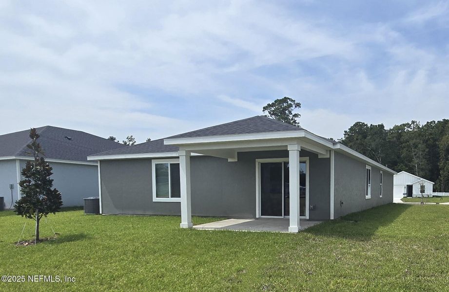 Front exterior of a new home in Azalea Creek, Jacksonville, FL, highlighting curb appeal (Image 19).