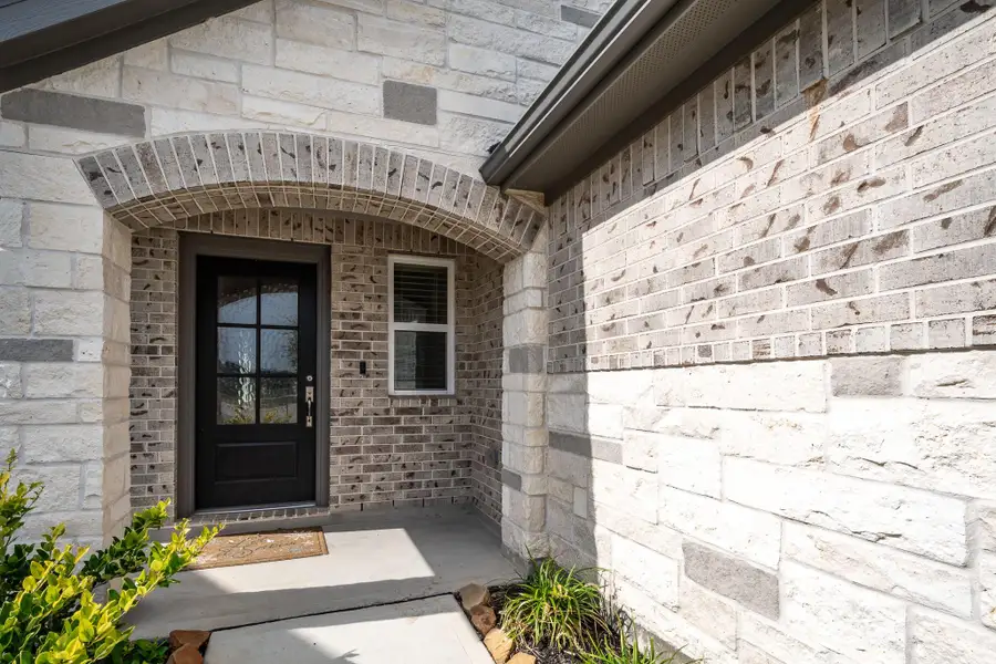 Exterior details and patio area of a home in Marisol, Katy (Image 3). Exterior details and patio area of a home in Marisol, Katy (Image 3).