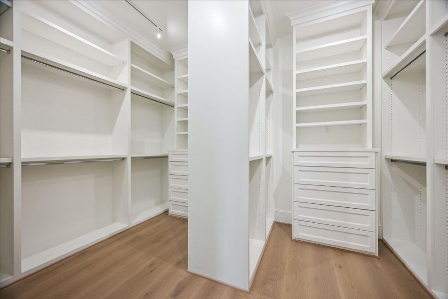 Large primary closet with built-ins for all needs (hardware to be installed)