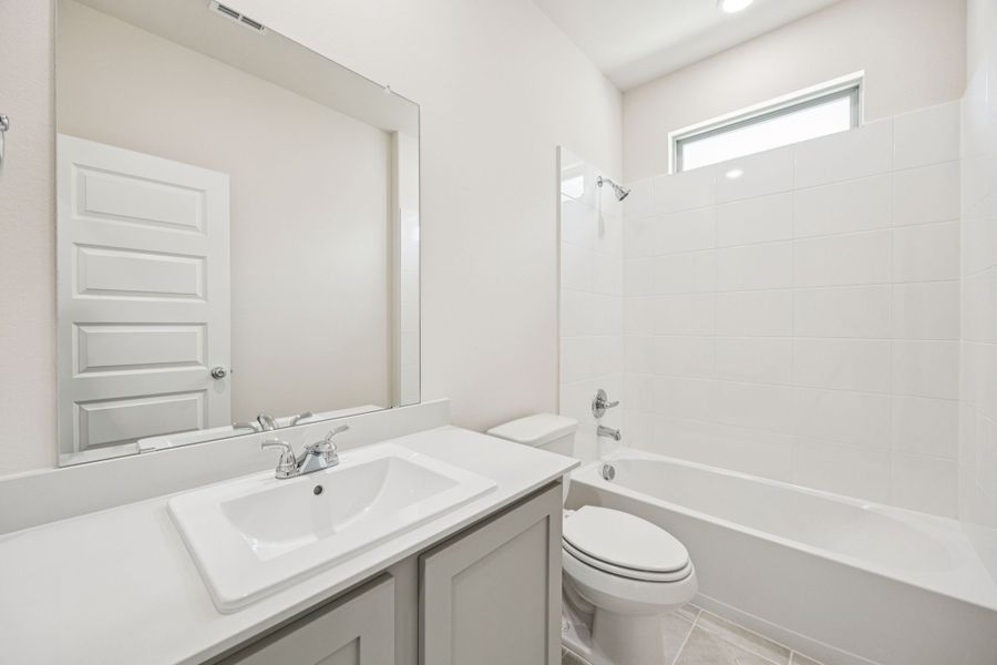 Bathroom in the Claret home plan by Trophy Signature Homes – REPRESENTATIVE PHOTO Bathroom in the Claret home plan by Trophy Signature Homes – REPRESENTATIVE PHOTO