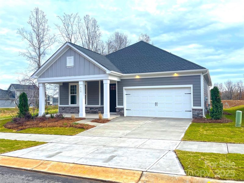 Front exterior of a new home in The Terraces at Cramerton Mills, Cramerton, NC, highlighting curb appeal (Image 14).