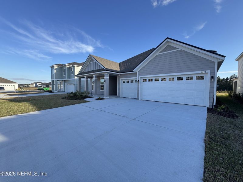 Front exterior of a new home in , Green Cove Springs, FL, highlighting curb appeal (Image 5).
