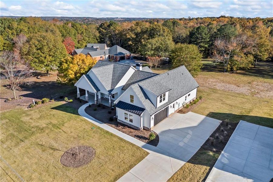 Front exterior of a new home in , Monroe, GA, highlighting curb appeal (Image 2).