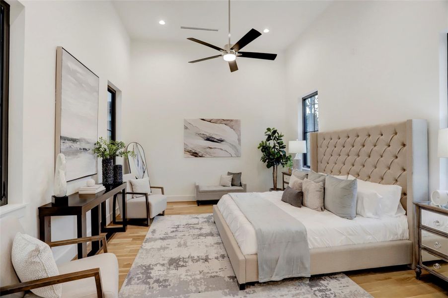 The first-floor primary retreat is situated at the back of house with 14' ceilings and also overlooks the turf courtyard.