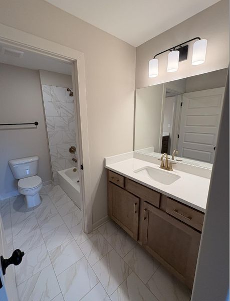 Bathroom vanity with a white countertop and undermount sink