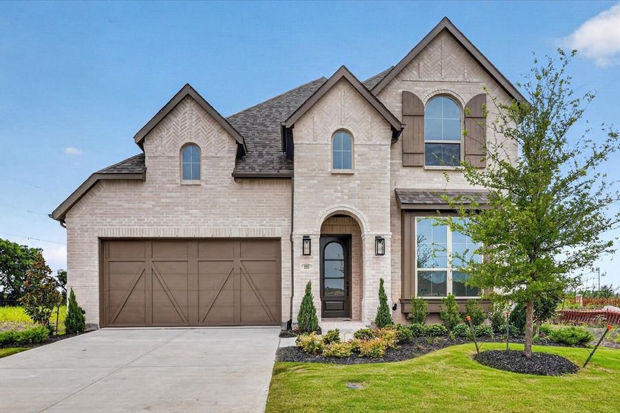 Front exterior of a new home in The Parks at Wilson Creek, Celina, TX, highlighting curb appeal (Image 1). Front exterior of a new home in The Parks at Wilson Creek, Celina, TX, highlighting curb appeal (Image 1).