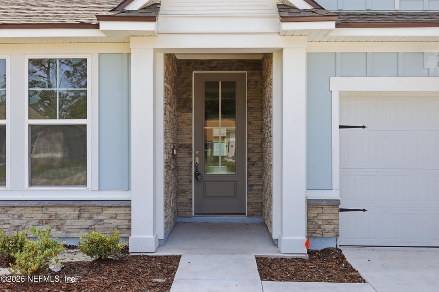Exterior details and patio area of a home in Palm Coast Homes, Palm Coast (Image 3).