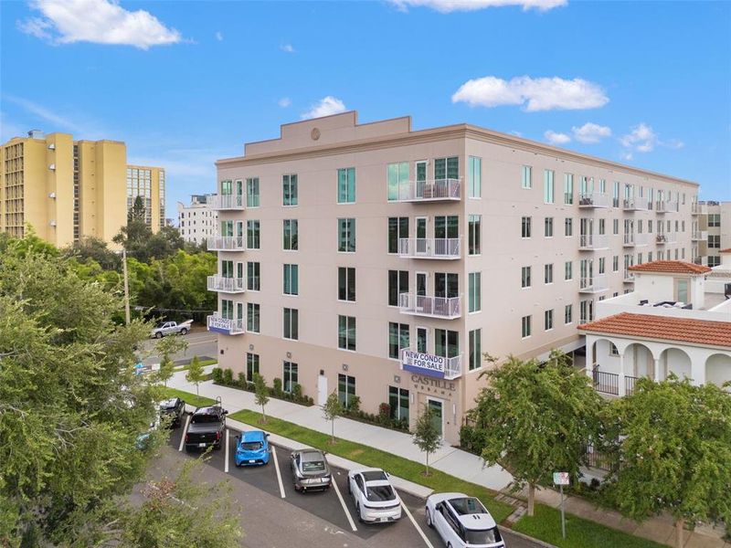 Front exterior of a new home in Castille Urbana, St. Petersburg, FL, highlighting curb appeal (Image 1).