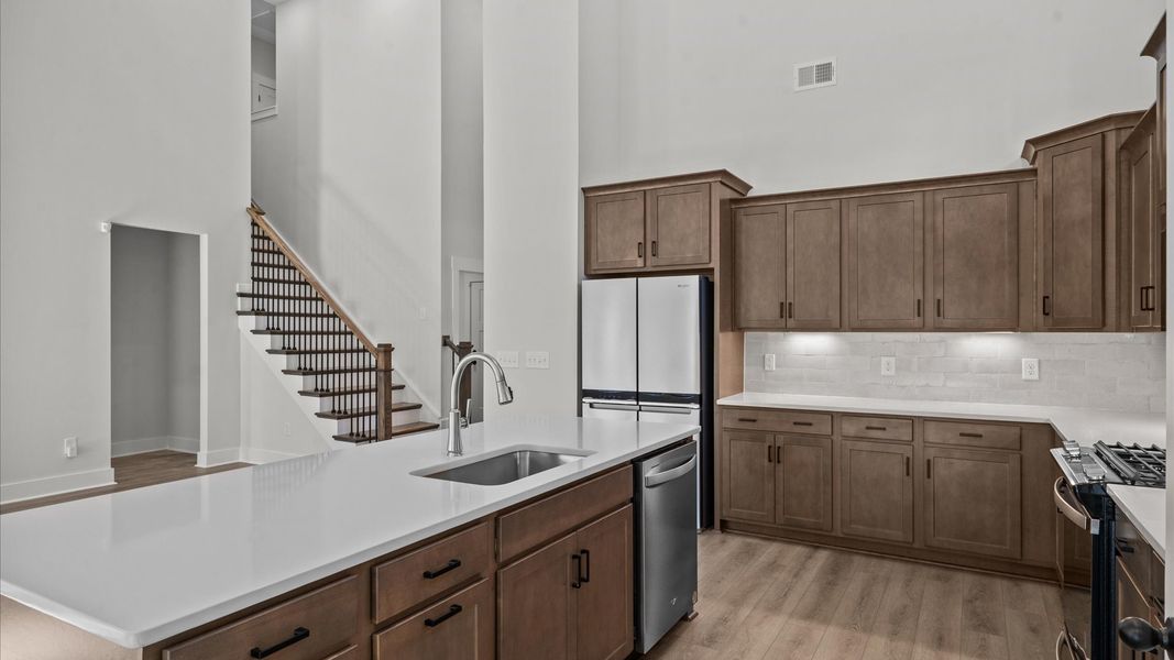 Accomplished design in a kitchen that blends function and form with an 8-foot island Accomplished design in a kitchen that blends function and form with an 8-foot island