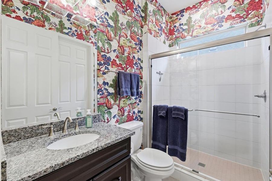 Spacious Guest Bedroom featuring a Private En-suite Bath, Designer Thibaut Wallpaper, and Plantation Shutters.