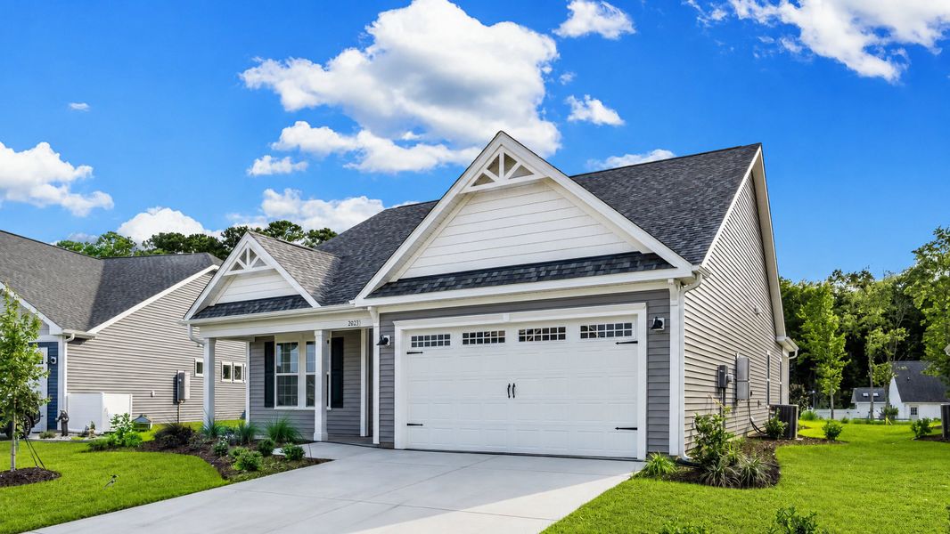 Front exterior of a new home in Bridgewater - Shorehaven Village, Little River, SC, highlighting curb appeal (Image 2). Front exterior of a new home in Bridgewater - Shorehaven Village, Little River, SC, highlighting curb appeal (Image 2).