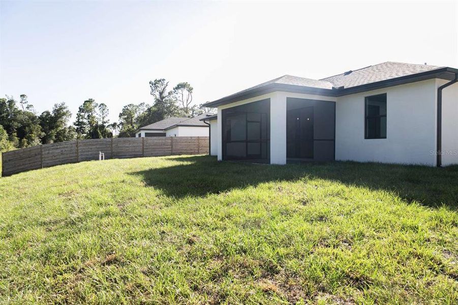 Exterior details and patio area of a home in , North Port (Image 32).