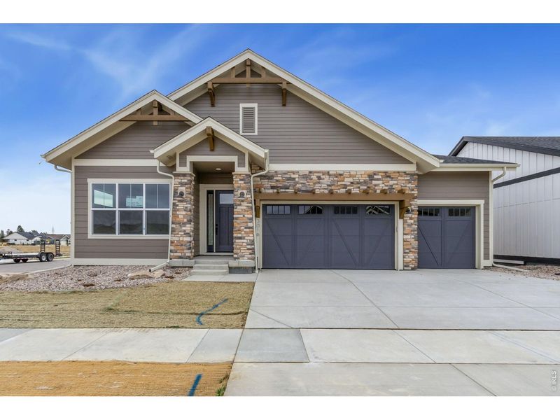 Front exterior of a new home in , Fort Collins, CO, highlighting curb appeal (Image 2).