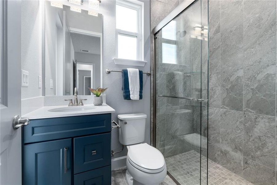 Walk-in Shower & Quartz Vanity Walk-in Shower & Quartz Vanity