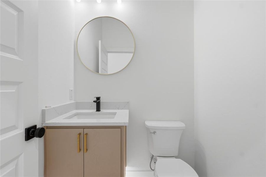 Bathroom featuring vanity and toilet Bathroom featuring vanity and toilet