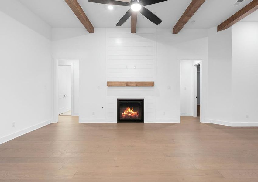 The spacious family room has an electric fireplace.