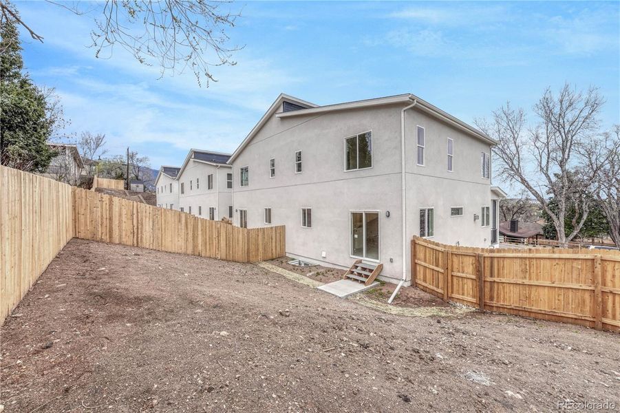 Front exterior of a new home in , Colorado Springs, CO, highlighting curb appeal (Image 20). Front exterior of a new home in , Colorado Springs, CO, highlighting curb appeal (Image 20).