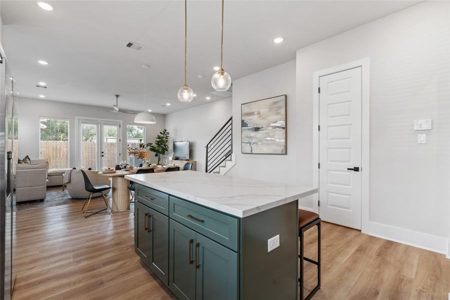 An open kitchen and dining layout where scale and flow come together, anchored by a central island and a dining area that comfortably seats six. Welcome to Pech Landing!
