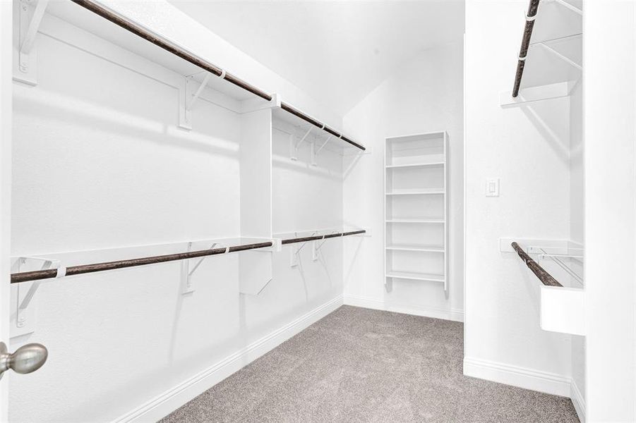 Walk in closet in primary and connects to laundry room.