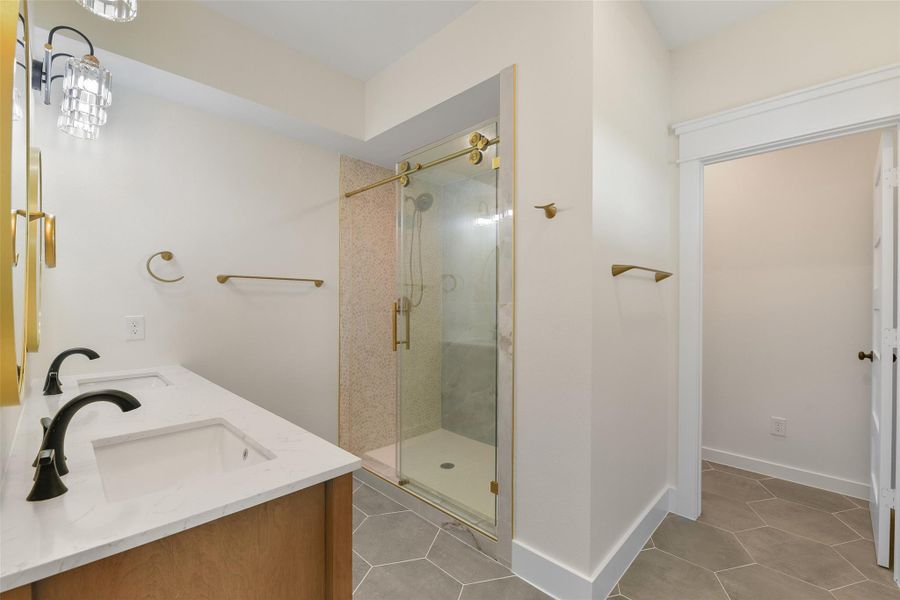 Complete with an oversized walk-in shower. Complete with an oversized walk-in shower.