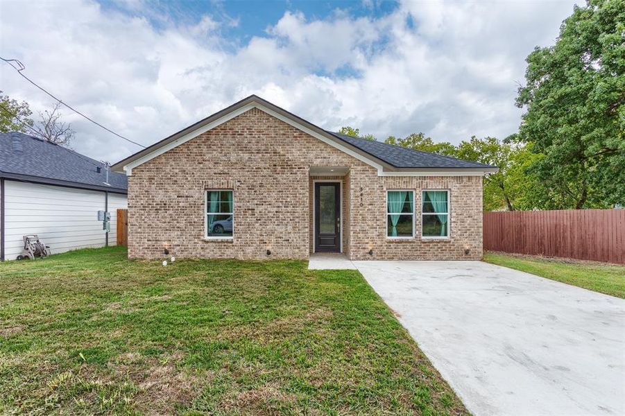 View of front of home featuring a front lawn