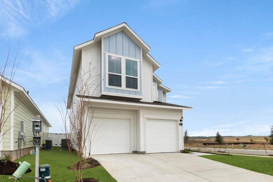 Front exterior of a new home in Harvest Ridge, Elgin, TX, highlighting curb appeal (Image 2).