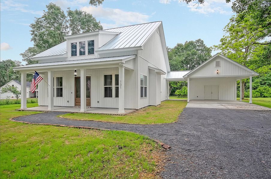 Front exterior of a new home in , Huger, SC, highlighting curb appeal (Image 1).